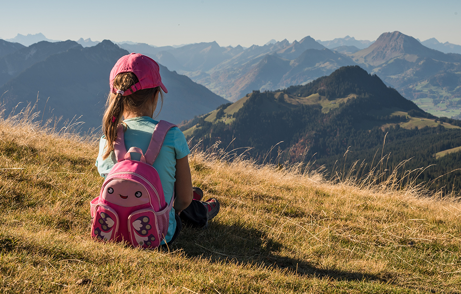 girl sitting with a backpack.